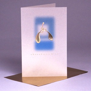 A beautiful Christmas card with metallic gold mistletoe and a gold foil envelope. The front of the