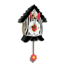 This novelty cuckoo clock features an orangutang that pops its head out of the door and makes a