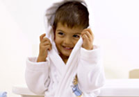 Velour hooded children`s robe with Peter Rabbit embroidery detail. Age 2-3 yrs. Available in White. 