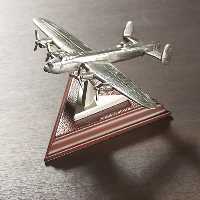 Finely detailed and presented on an attractive walnut effect stand  these six pewter planes are