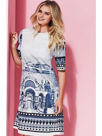 Stunning and glamorous, chic and sophisticated this designer style dress is a must have for the season. A line in shape with scenic placement print to both front and back, exposed back zip fastening, elbow length sleeves and two side pockets. Fully l