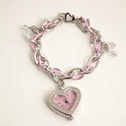 A beautiful pink and Silver plated charm bracelet with a heart shaped clock charm