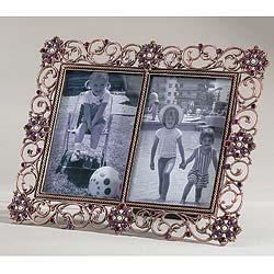 Studded with wine-red stones and faux seed pearls, this lacy openwork frame takes two photographs
