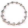 Beautiful mystical swirls of silver, evocative of the ocean, whirl around the wrist on this bracelet