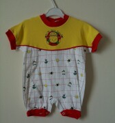 Red, white and yellow romper with popper fastening