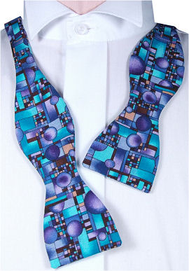 A lovely purple, blue and brown self-tie geometric patterned bow tie.