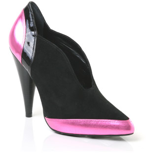 Pointed toe leather ankle boot featuring patent and suede overlay detail and a very high cone heel. 