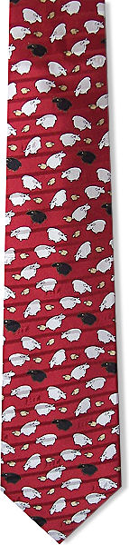 A lovely red silk tie with cartoon-like white and black sheep all over.