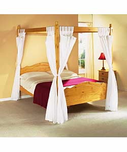 Honey coloured solid pine 4 poster bed with turned
