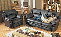 An attractive contemporary leather model featuring a winged back which the back cushions fit snugly