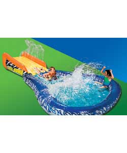 Giant inflatable sliding ramp goes speeding down into the mega sized splash pool.Inflatable body boa