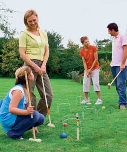 4 player, 4 balls, 4 mallets and hoops. Manufactured from planed smooth timbers.Garden fun for all a
