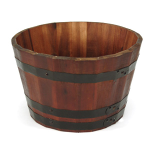 Add a rustic touch to your patio or garden with this stained acacia barrel planter. It is secured wi
