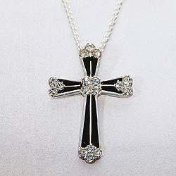 Our sterling silver cross is inspired by the bold contrasting colours and geometric patterns used