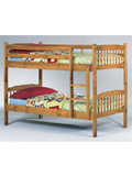 An excellent solid pine bunk bed with turned spindles. The bed features a side ladder plus side