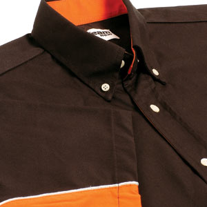 This Teamwear Touring shirt has silver piping separating the 2 diverse colours of black and orange. 