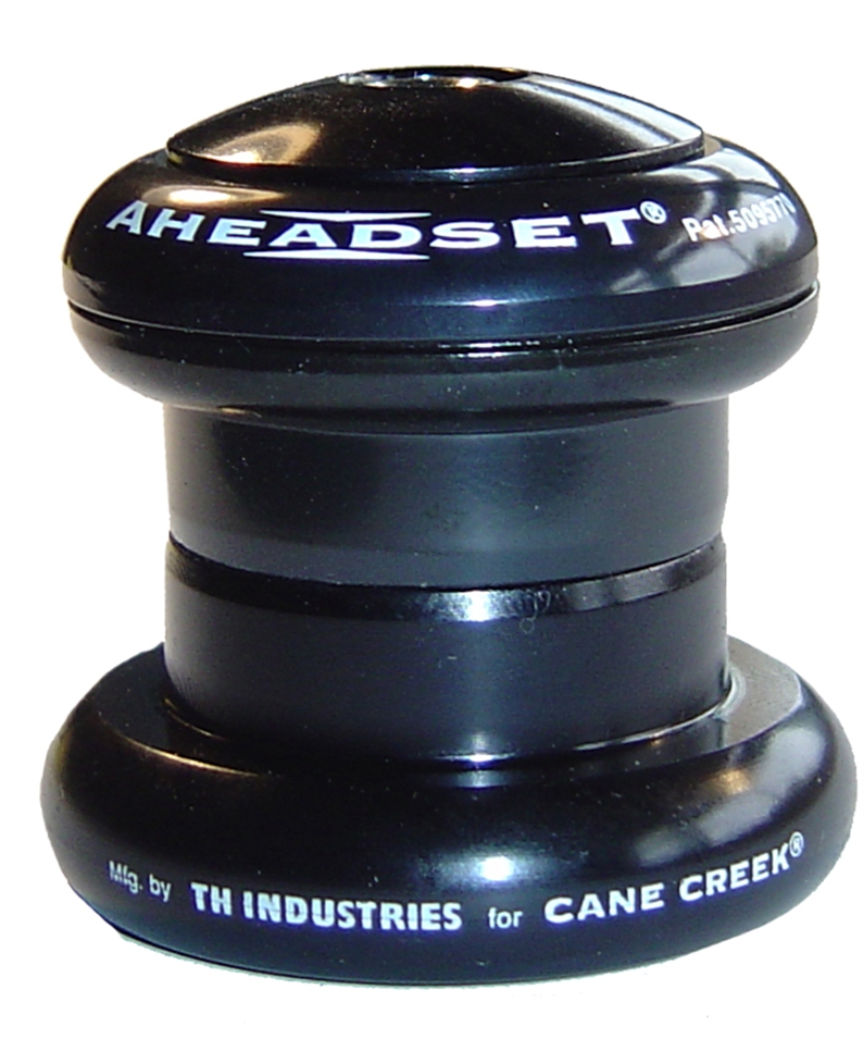 Conventional threadless headset. 6061-T6 forged and CNC machined cups, 5/32" x 20 caged ball