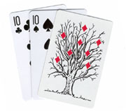 A comical version of a classic trick. Three cards are fanned and shown face up - two black tens and
