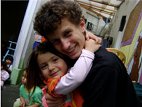 Unbranded Volunteer with street children in Quito, Ecuador