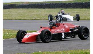 Theres no better way to spend a weekday than speeding around a professional track in a professional car  in this case, a smooth, low single-seater at Anglesey! After a quick safety brief, youll enjoy a fun five laps of the track following a pace c
