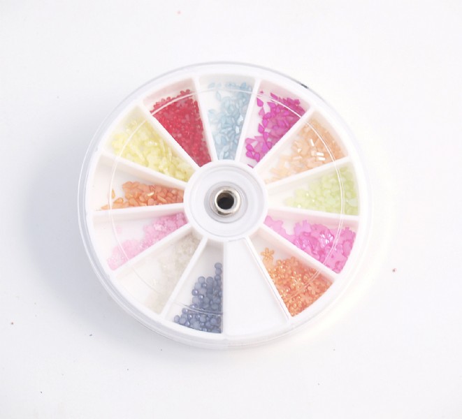 Mixed beads in a boxed wheel  helps create new and fun designs.  Mix of 12 different Beads.