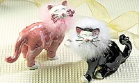 Ceramic cat with fluffy collar and crystal whisker tips. Choose from pink or black