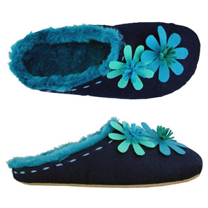 A Mule slipper from Jones Bootmaker. Features big contrasting felt flowers and coloured faux fur lin