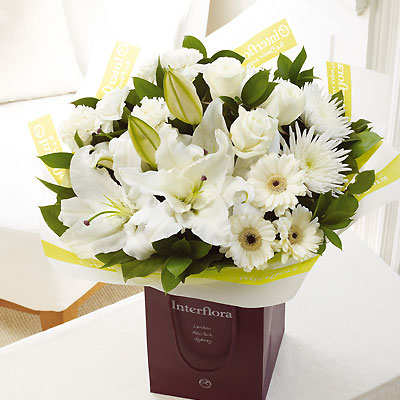 This sophisticated hand-tied bouquet in elegant white shades is a stunning gift to send no matter wh