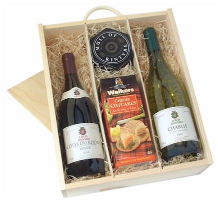A fine gift presented in wooden box  lined with decorative shred. Includes a bottle of Chablis  a