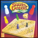 Traditional Snakes and ladders game with wooden board